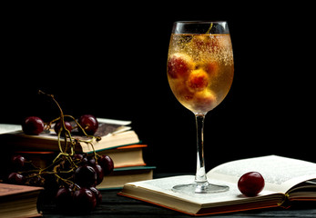 glass of cold champagne on a book