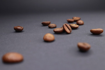  little man with coffee. grain on a dark background.