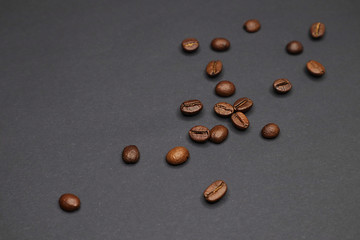 Fototapeta na wymiar little man with coffee. grain on a dark background.