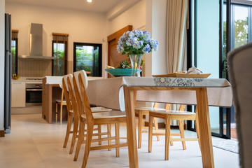 Dining area with pool view and fruits basket
