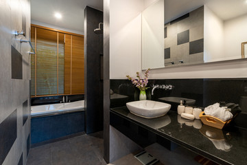 Modern bathroom with toilet, shower and bathtub
