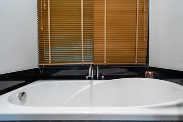 Modern bathroom with toilet, shower and bathtub