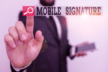 Writing note showing Mobile Signature. Business concept for digital signature generated either on a mobile phone Male human wear formal work suit hold hi tech smartphone use hand