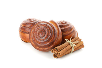 Freshly baked cinnamon roll with ingredients isolated on white background