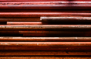 metal bars with traces of peeling bright paint