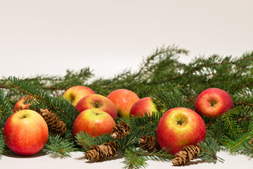 Christmas still life with pine branches, pine cones and apples  on a white background/ Merry Christmas / Happy New Year