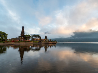 Fototapeta premium Indonesia, november 2019: Pura Ulun Danu Bratan temple in Bali island. Hindu temple in flowers on Beratan lake, Asia. Major water temple Bali. Hindu water temple - culture symbol of Indonesia,