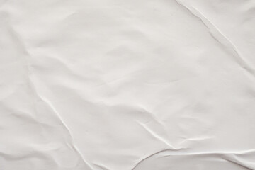 Blank white crumpled and creased paper poster texture background