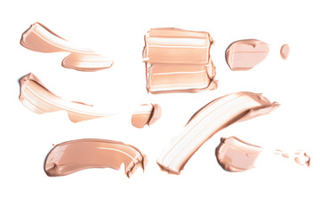 Set of Gently beige smears of makeup creamy foundation isolated on white background. Cosmetic...