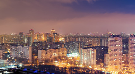 Naklejka na ściany i meble Night cityscape with lots of high rise buildings in residential area
