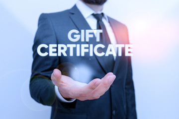 Conceptual hand writing showing Gift Certificate. Concept meaning certificate entitling the recipient to receive goods Male human with beard wear formal working suit clothes hand