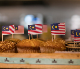 Mini Malaysia flag on delicious cupcakes. Independence, patriotic concept.