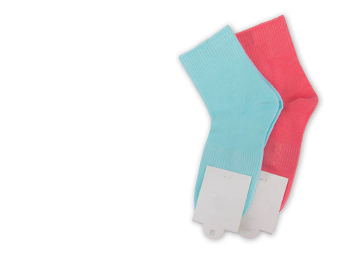 New Socks On A White Background. Colorful Socks With Beige Label For Your Design. Isolated Object
