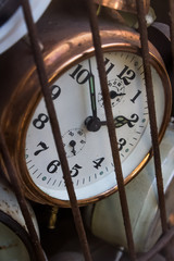 Old school retro vintage alarm clocks tracking time trapped in a bird cage rusty metal iron nice soft shadows slow dying feeling vibe historical objects hidden clock Prison locked away Chernobyl