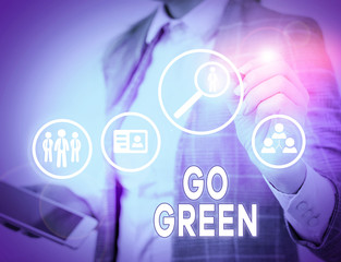 Conceptual hand writing showing Go Green. Concept meaning making more environmentally friendly...