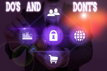 Writing note showing Do S Is And Dont S Is. Business concept for advising Rules or customs concerning some activity