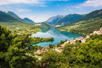 Fototapeta na wymiar Barrea, Italy: the Historical Typical Village seen from Top, with Mountains and Lake Landscape Panorama