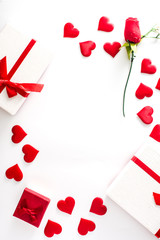 Valentine's Day background with heart, gift boxes and rose on white background. Copy space