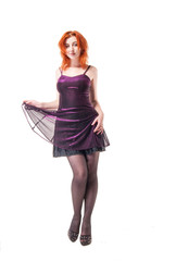 Naklejka premium young woman in tight black dress on white background