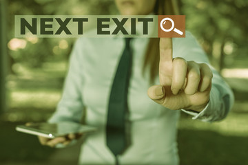 Word writing text Next Exit. Business photo showcasing the following way out or act of leaving in a place or highway Handsome business girl pointing with finger into empty space