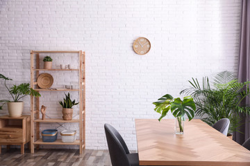 Stylish room interior with green plants. Home decoration