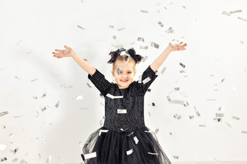 Plakat Party, holidays, new year and celebration concept - Female child throwing confetti.