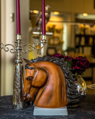 horse head figurine and silver candlestick