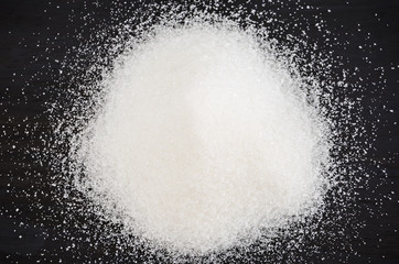 white sugar on a black background