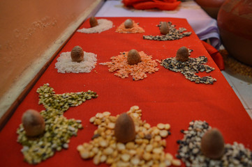 Beautiful decoration of supari, betalnut, areca nut, pulses, rice for worship of indian god.