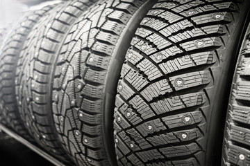 new winter studded tires in store. sale of winter wheels. ice, seasonal change of tires.