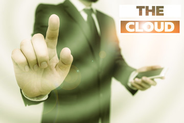 Word writing text The Cloud. Business photo showcasing Programs used in Storing Accessing data over the internet Male human wear formal work suit hold smart hi tech smartphone use one hand