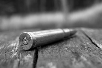 Fototapeta na wymiar close up of black and white 50 mm caliber bullet background