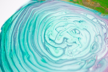 The girl creates a picture with abstraction in bright colors.