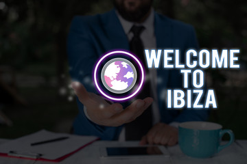 Conceptual hand writing showing Welcome To Ibiza. Concept meaning Warm greetings from one of...