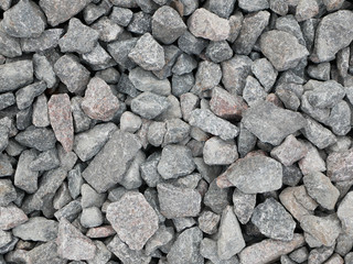 gray pebbles. Close-up. masonry, material, surface, flat, front, view, pattern, abstract, background, design. pebbles of gray color.