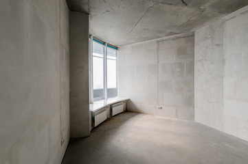 Russia, Moscow- July 16, 2019: interior room. rough repair for self-finishing. interior decoration, bare walls of the room, stage of construction