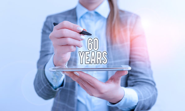 Handwriting text 60 Years. Conceptual photo It is the onset of a golden era Commemorating a special day Business concept with mobile phone and business woman