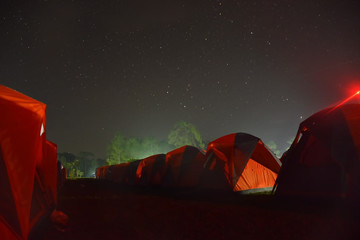 The camping on a quiet night have stars in the sky and the tent was so beautiful.
