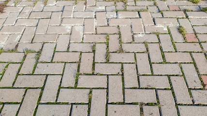 Street with stone paving stones. Cobble stone blocks as background.