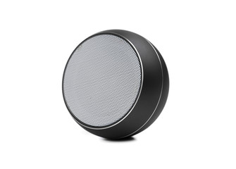 Wireless speaker on a white background. Round music speaker close-up.