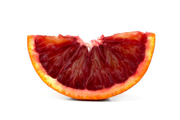 Bloody orange on a white background. A slice of red orange on a white background.