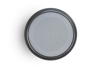 Wireless speaker on a white background. Round music speaker close-up.