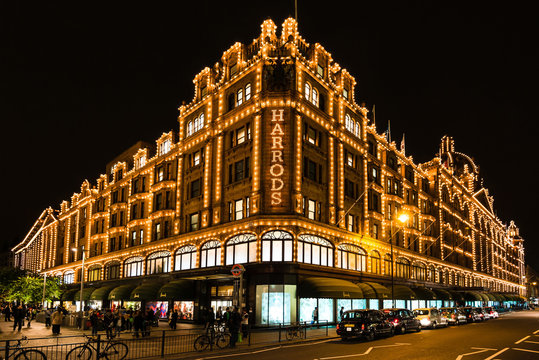 Harrods department store in London at night