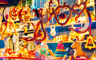 Christmas Tree Wooden Toys and Decorations on Christmas Market in Winter Riga, Latvia. Advent Fair Decoration, and Stalls with Crafts Items in Bazaar. Street Xmas and holiday fair in European city.