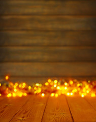 Wooden background with bright lights with a free space for text or product demonstration
