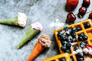 Appetizing ice cream with fruits and waffles, the ideal snack in a restaurant in summer.