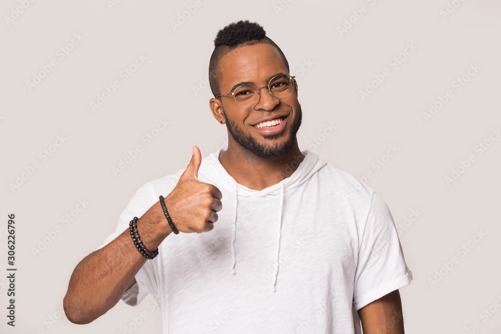 Wall mural happy african american man showing thumbs up gesture, satisfied client