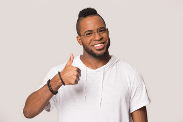 Happy African American man showing thumbs up gesture, satisfied client