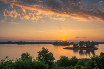 Fototapeta na wymiar Sunrise over the Soltmany lake near Kruklanki, Masuria, Poland