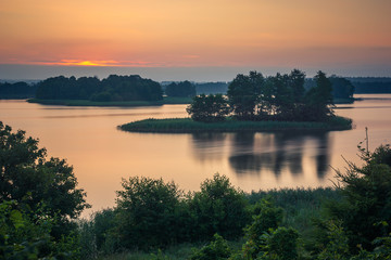 Sunrise over the Soltmany lake near Kruklanki, Masuria, Poland